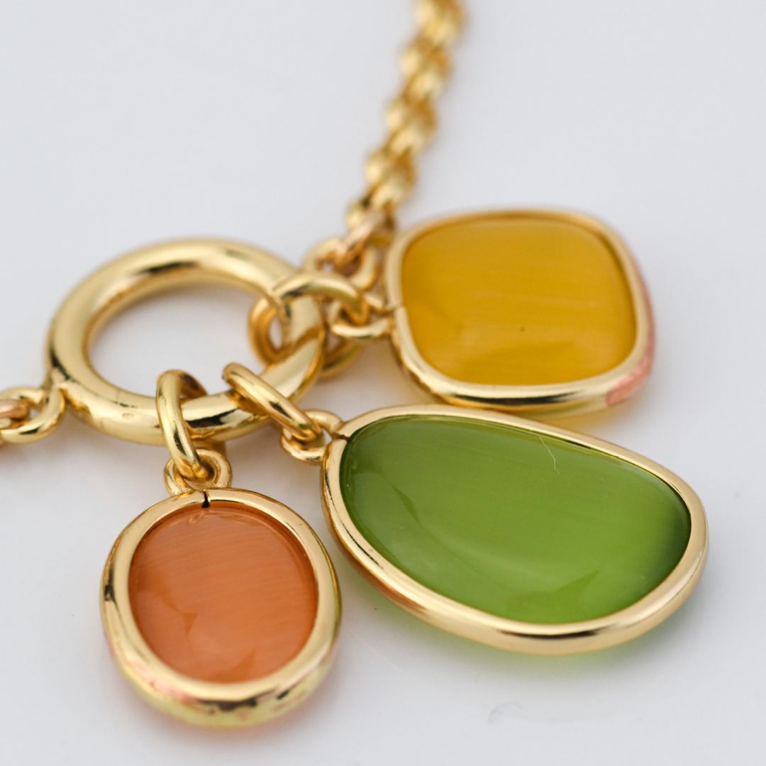 Bracciale placcato oro giallo con cristalli centrali miele, verde e giallo XB1027D