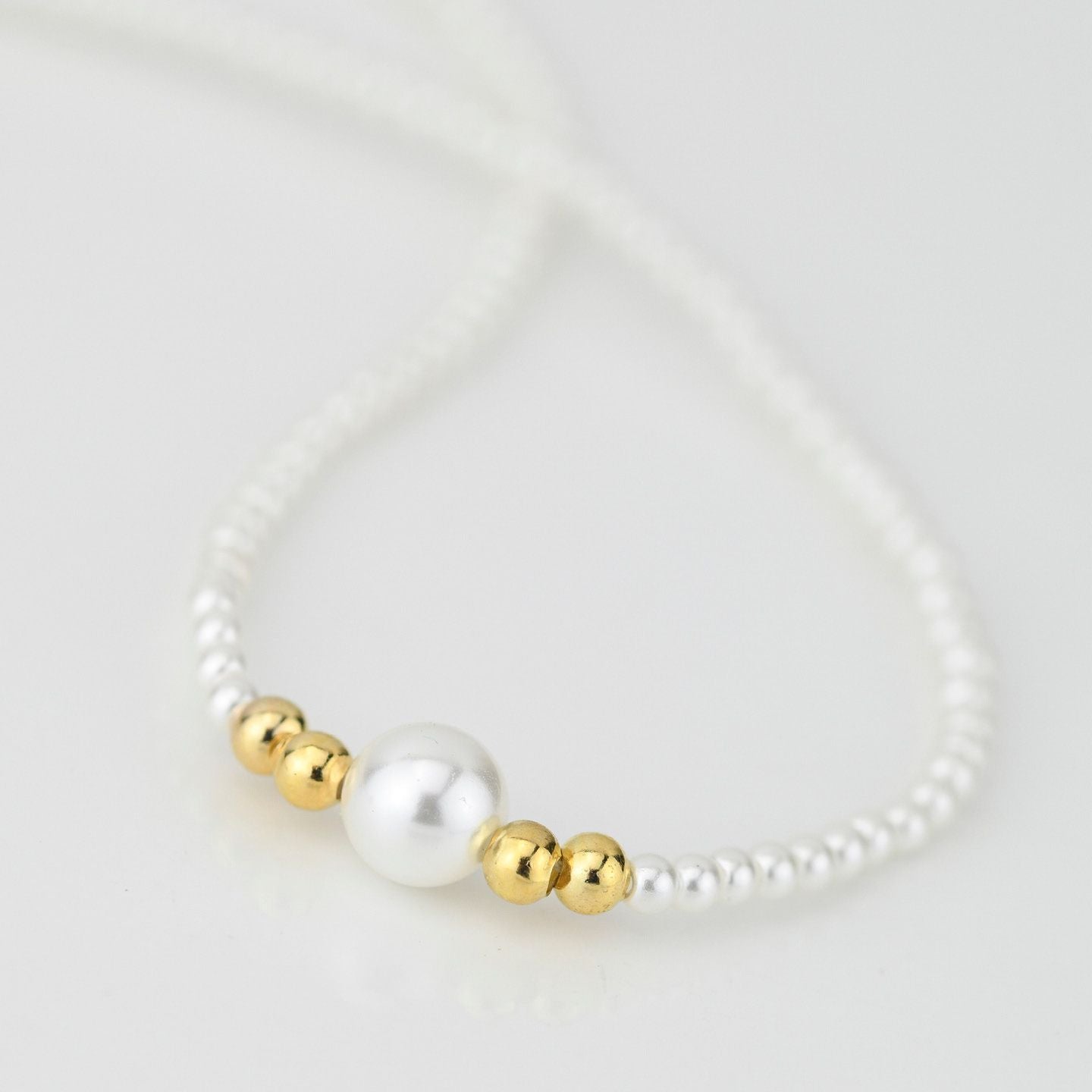 Collana di perle in argento placcato oro giallo con perla centrale grande GR909D
