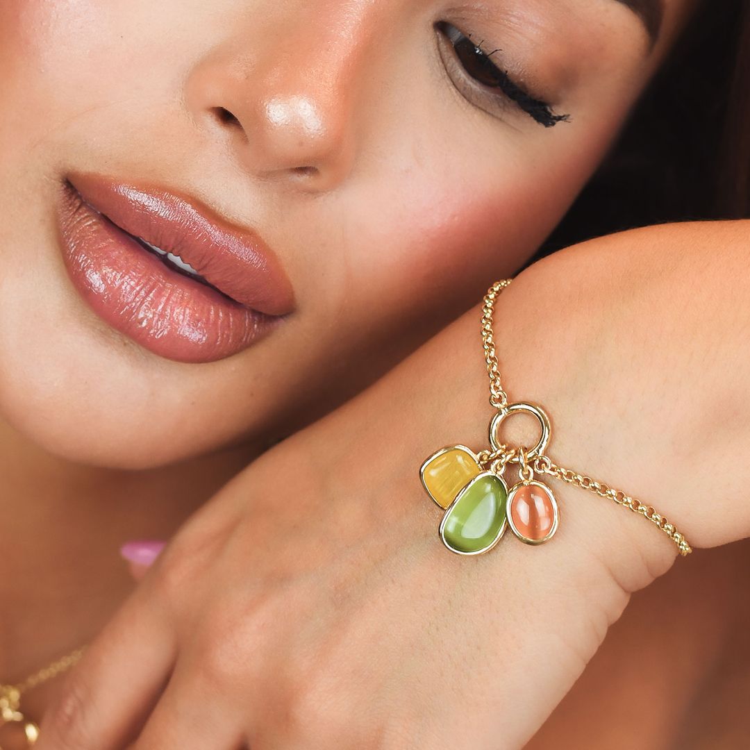 Bracciale placcato oro giallo con cristalli centrali miele, verde e giallo XB1027D