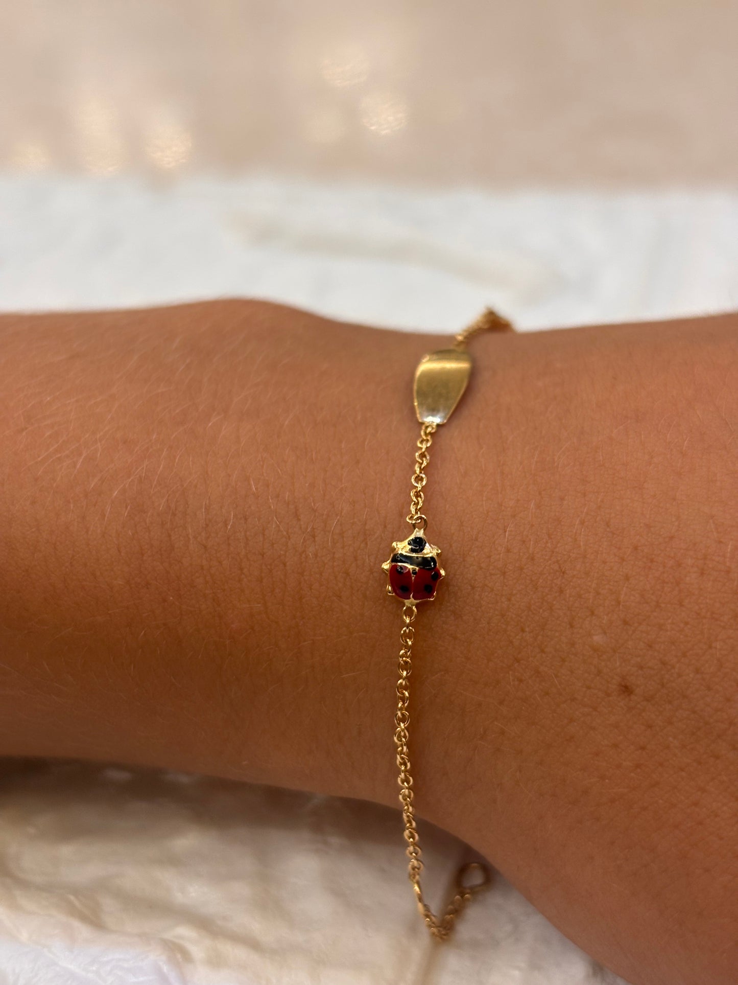 Bracciale Bimbo/a oro 18 carati coccinelle e targa