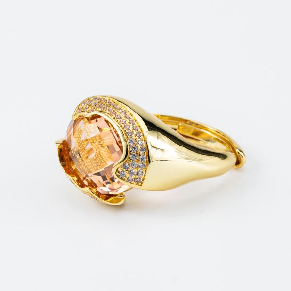Anello placcato oro giallo a fascia aperta con cristallo centrale sfaccettato peach circondato da zirconi incastonati XAN233DO