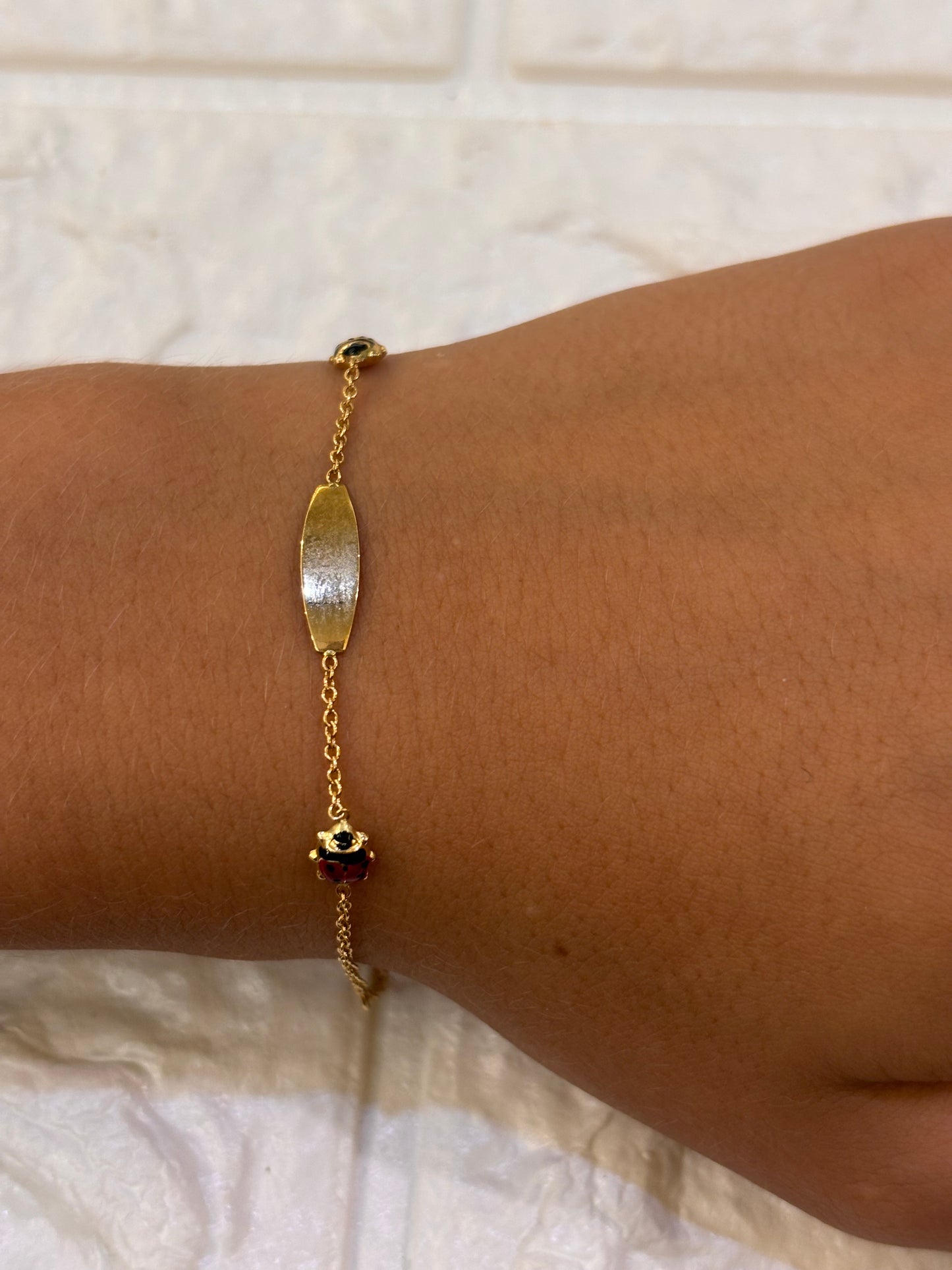 Bracciale Bimbo/a oro 18 carati coccinelle e targa