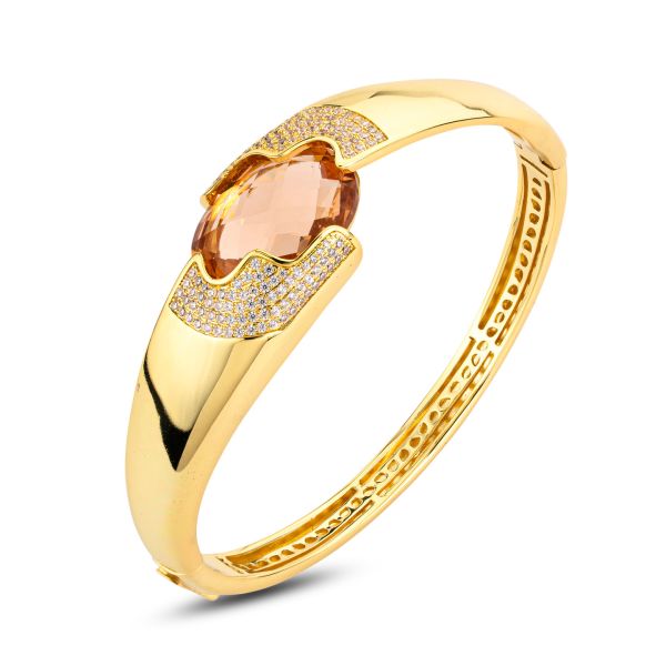 Bracciale rigido placcato oro giallo a fascia larga con cristallo centrale peach a forma ovale XB1064DO